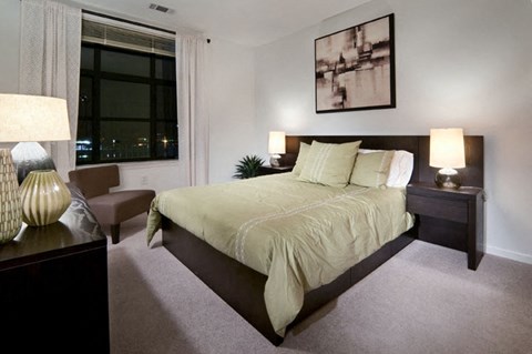 a bedroom with a large bed at The Sheffield at Englewood in Englewood, NJ