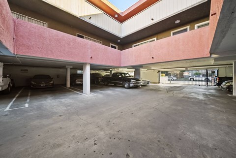 A parking garage with cars parked in it.