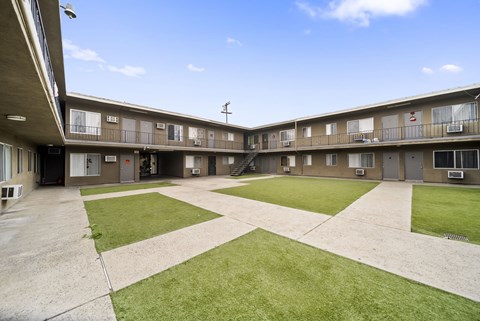 A sunny day at the courtyard of apartment buildings.