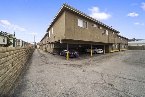 A parking lot with a building in the background.