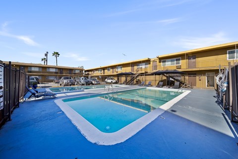 A swimming pool with a blue tinted water.
