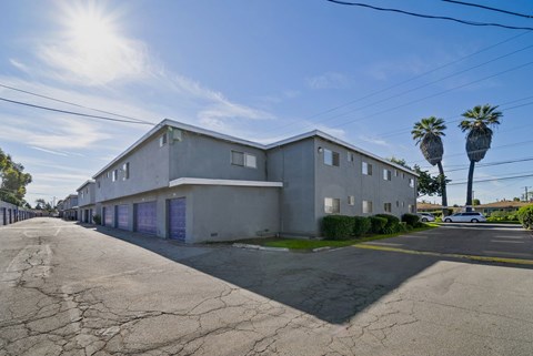 A building with a cracked road in front of it.