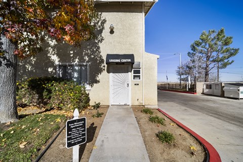 A sign in front of a building that says "LEARNING CENTER".