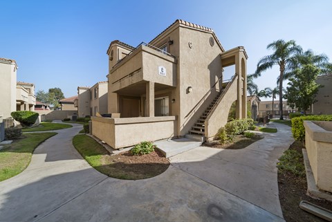 A concrete staircase leads up to a building entrance.
