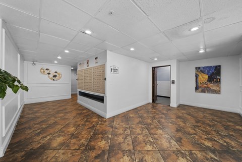 A room with a wooden floor and a white ceiling.
