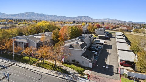A view of a residential area with houses and trees.