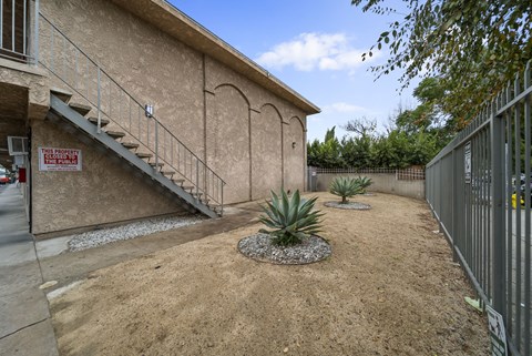 A house with a sign that says "No Trespassing" on the wall.