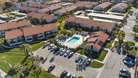 A residential area with houses and a swimming pool.