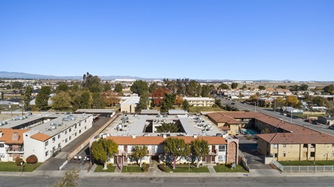 A view of a residential area with houses and trees.