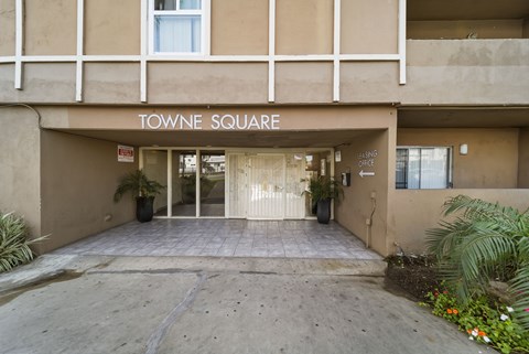 Towne Square building entrance with a sign above the door.