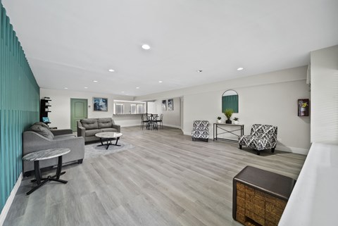 A living room with a grey sofa and a wooden coffee table.