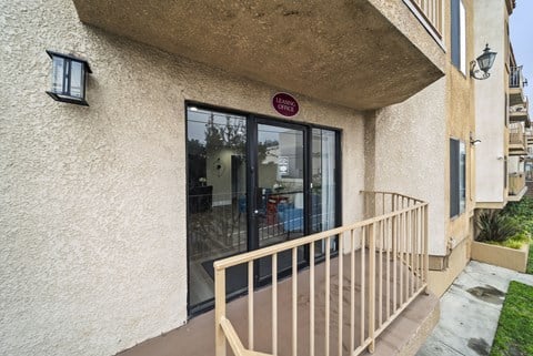 A building with a red sign on the door.