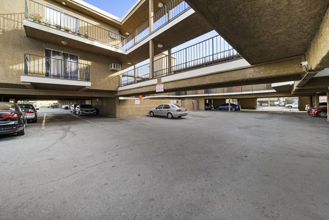 A parking garage with cars parked in it.