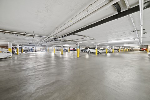 A spacious parking garage with concrete floors and multiple levels.