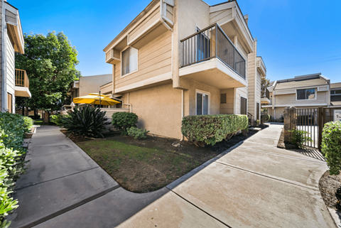 A residential area with a house and a driveway.