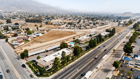 A view of a city with a highway running through it.
