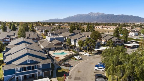 A residential area with houses and a swimming pool.