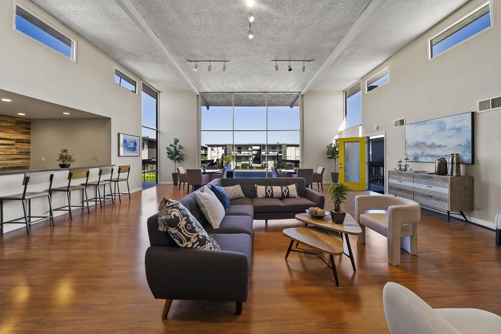 A modern living room with a large couch and a coffee table.