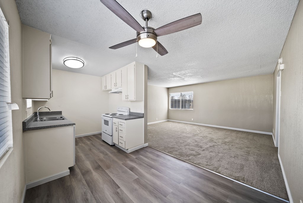 A kitchen with a fan and a countertop.