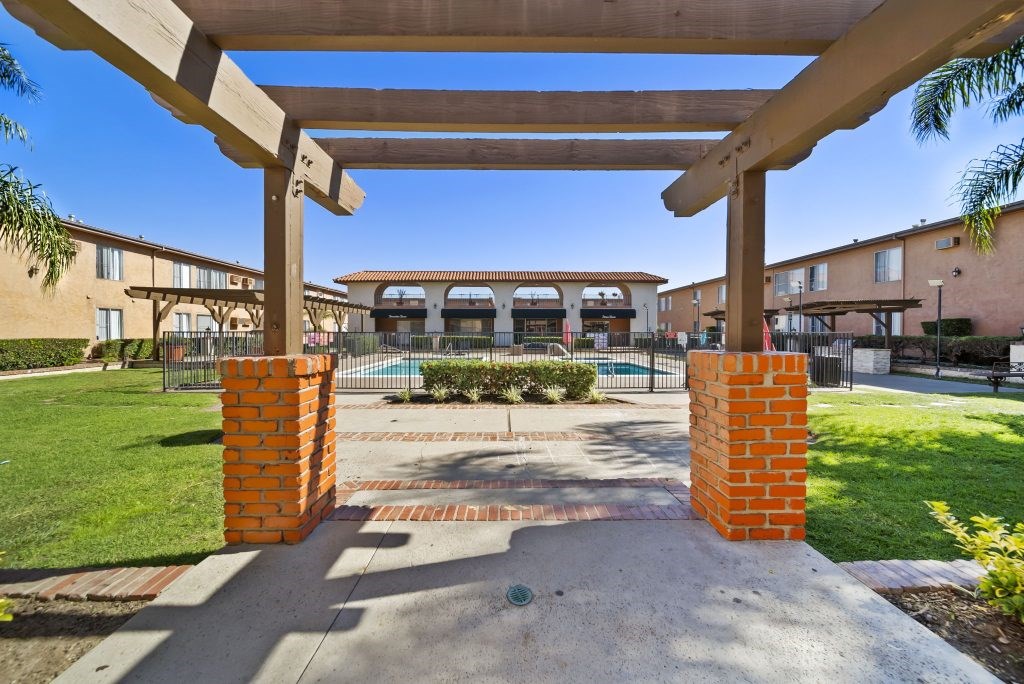 A view of a building with a walkway leading to it.