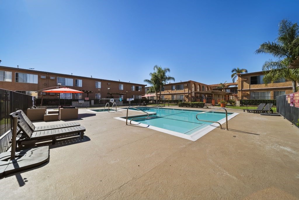A pool area with a clear blue sky above.