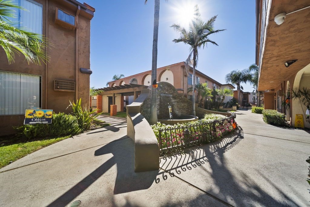 A sunny day at a residential area with a clear blue sky.