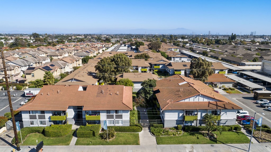 A residential area with houses and a clear sky.