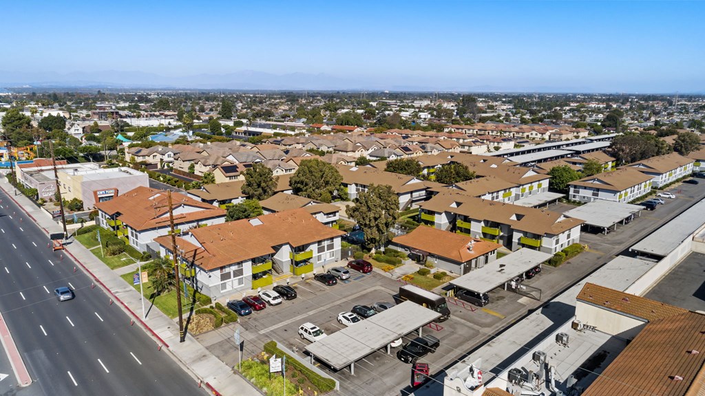 A view of a residential area with houses and a road.