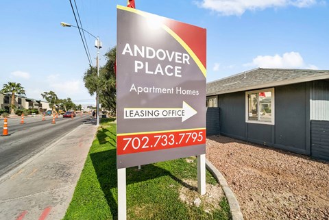 A sign for Andover Place Apartment Homes with a leasing office phone number.