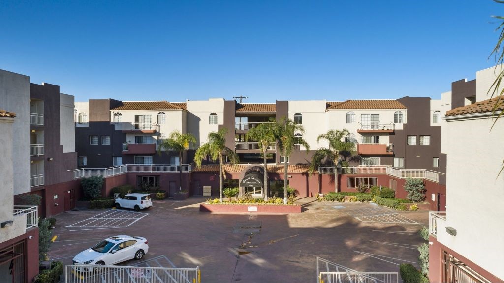 A white car is parked in a parking lot.
