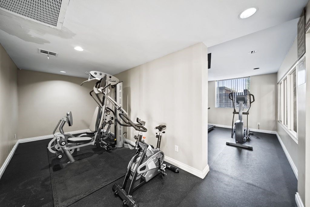 A spacious gym with a variety of exercise equipment.