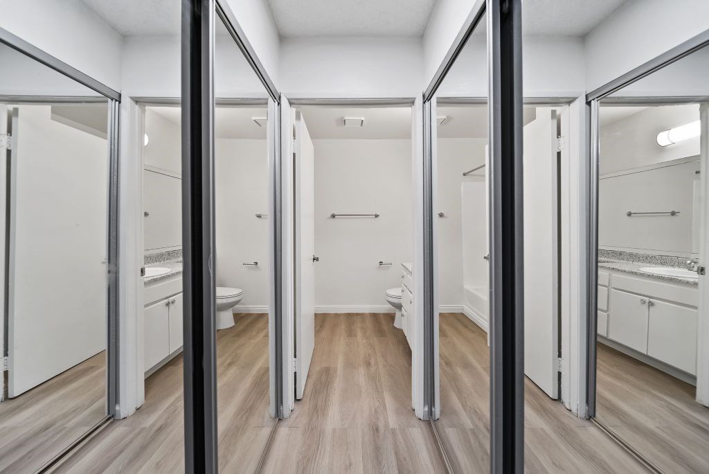 A spacious bathroom with a vanity and a toilet.