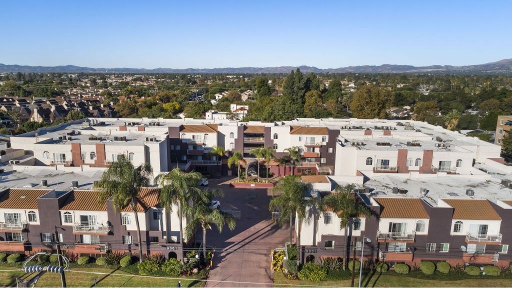 A large apartment complex with a courtyard in the middle.