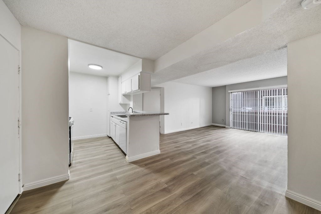 A kitchen area with a sink and a window.