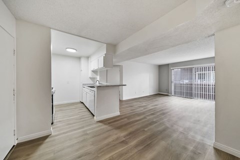 A kitchen area with a sink and a window.