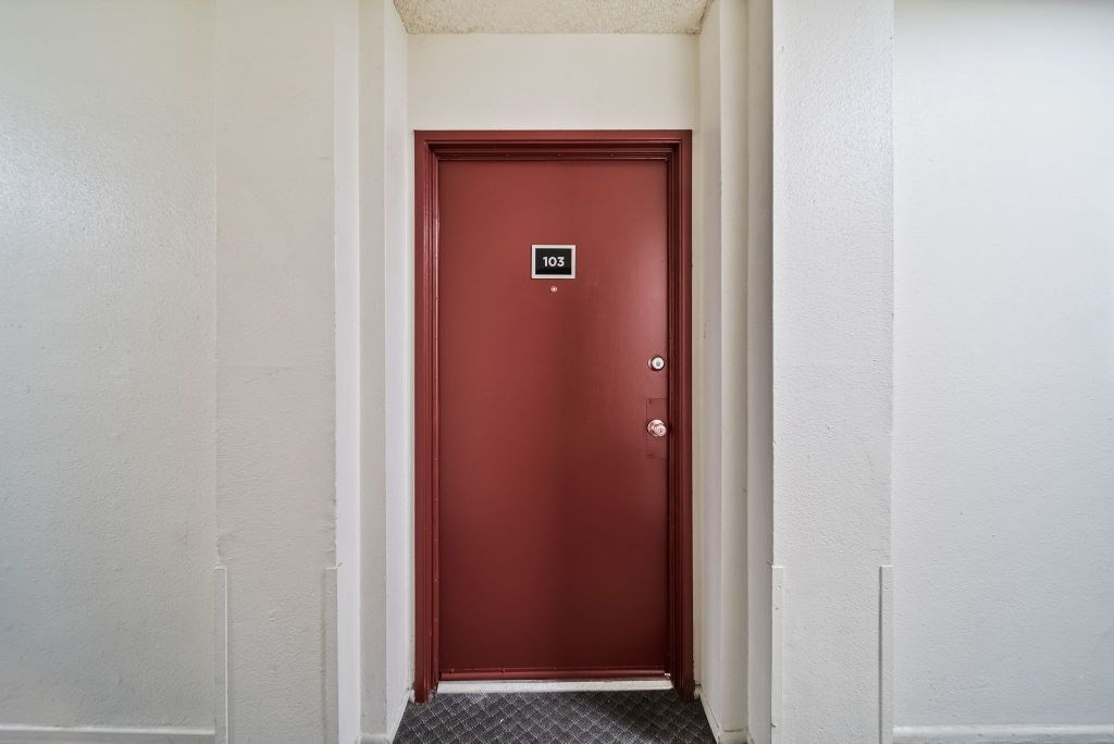 A red door with a number 10 on it.