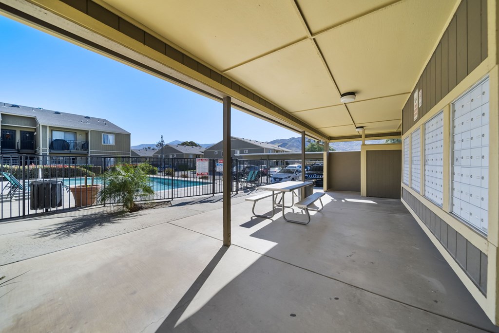 A sunny day at the poolside with a clear blue sky.