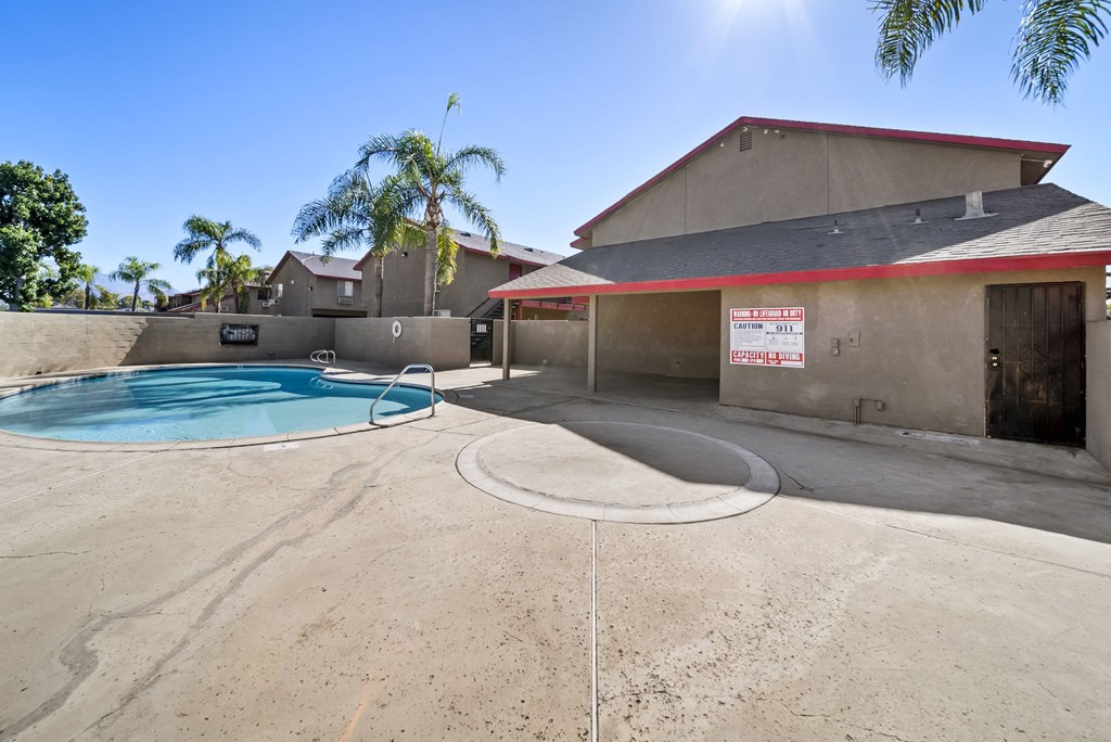 A house with a pool in the backyard.