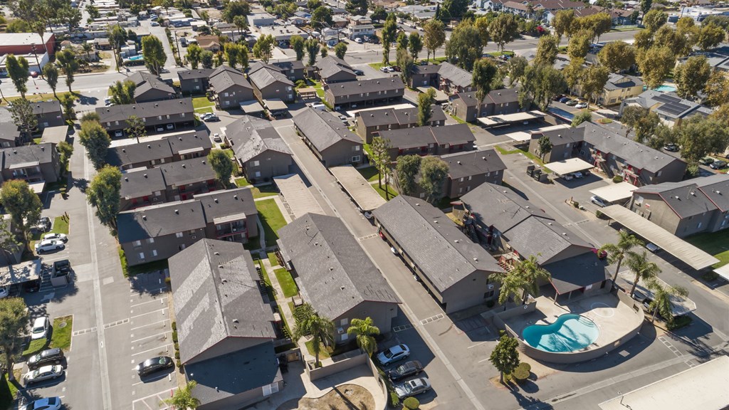 A residential area with houses and a swimming pool.