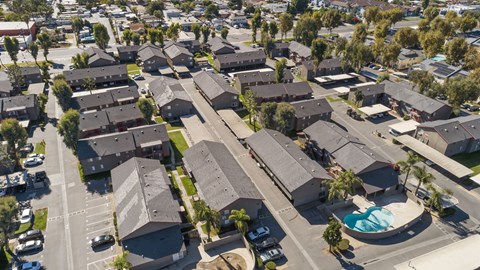 A residential area with houses and a swimming pool.