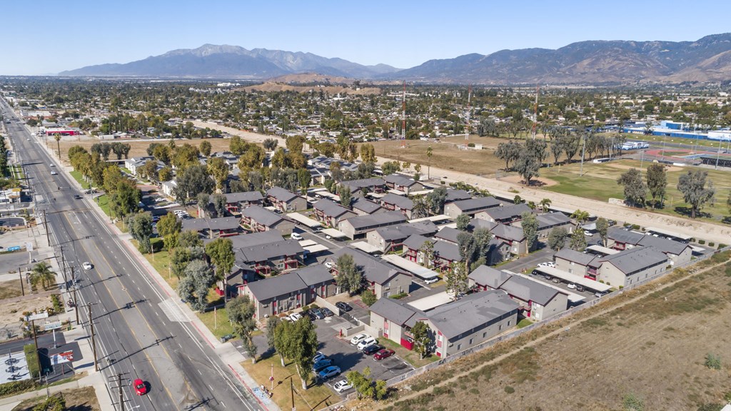 A suburban area with houses and a road.