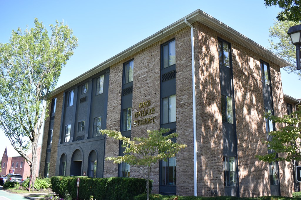 a brick building with a sign on the side of it