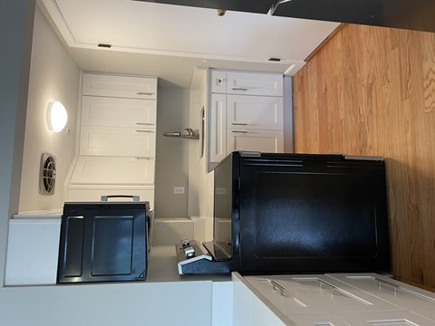 a kitchen with a microwave and a refrigerator