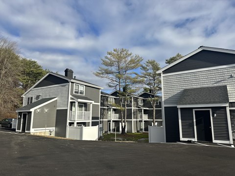 a row of houses with a parking lot