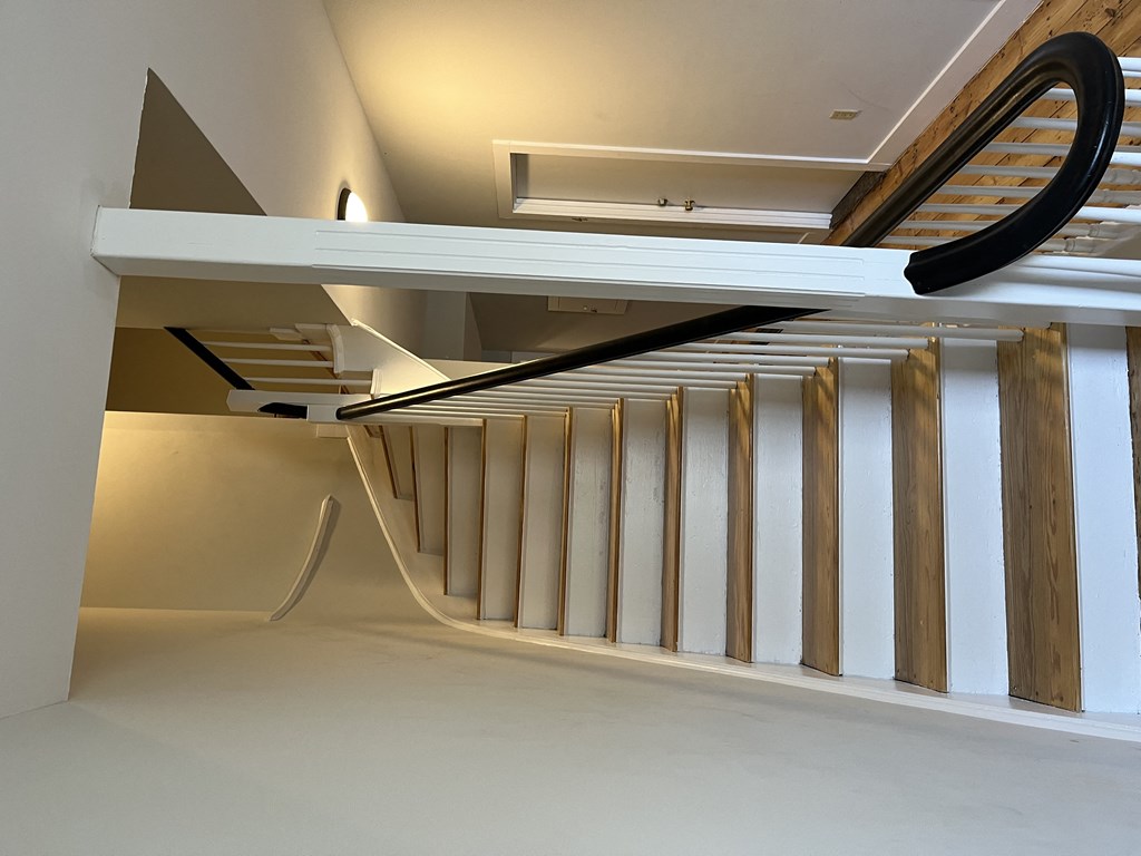 a view of the stairwell from the ground floor