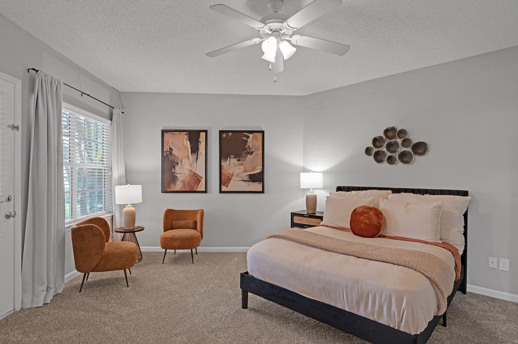 Bedroom with bed and ceiling fan Bedroom with bed and ceiling fan at Harrison Grande, Cary, NC, 27513