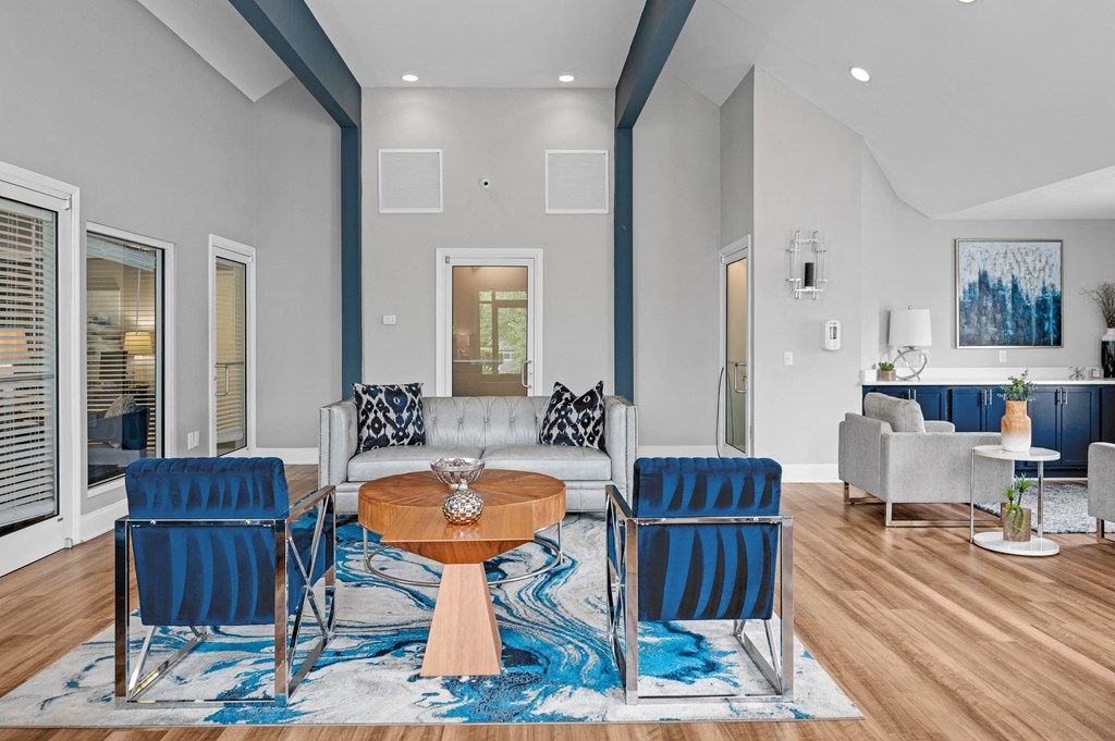 Living room with blue chairs and a couch  at Harrison Grande, North Carolina, 27513