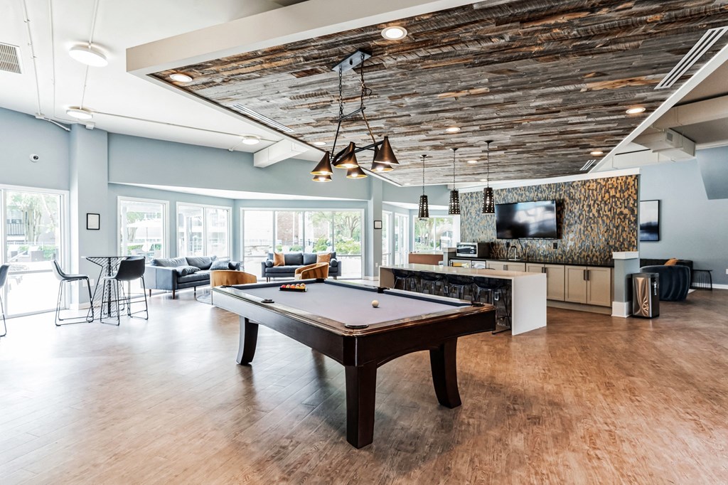 a game room with a pool table and a tv a game room with a pool table and a tv at Harrison Grande, Cary, NC