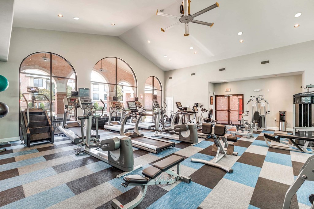 Spacious fitness center with treadmills and elliptical machines at Vintage Park Apartments, Houston, TX 77070