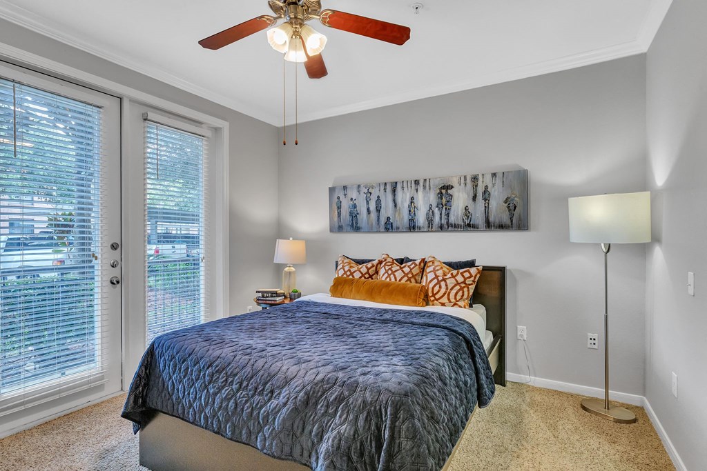Bedroom with a bed and a ceiling fan at Vintage Park Apartments, Houston, TX 77070